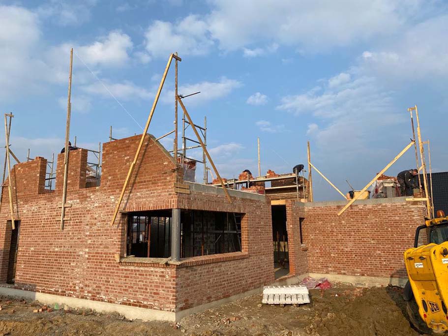 Construction d’une maison traditionnelle en brique croisé de 22 à Aubers